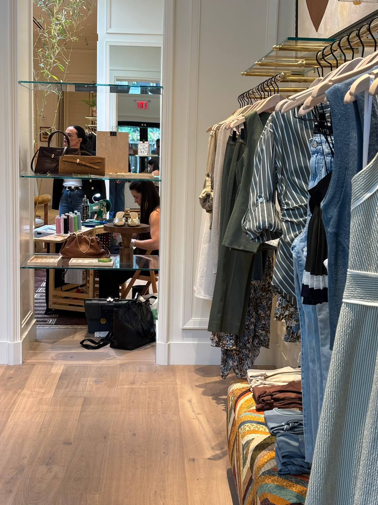 photo of a chainstitch embroidery retail activation inside a clothing retailer featuring petite setup