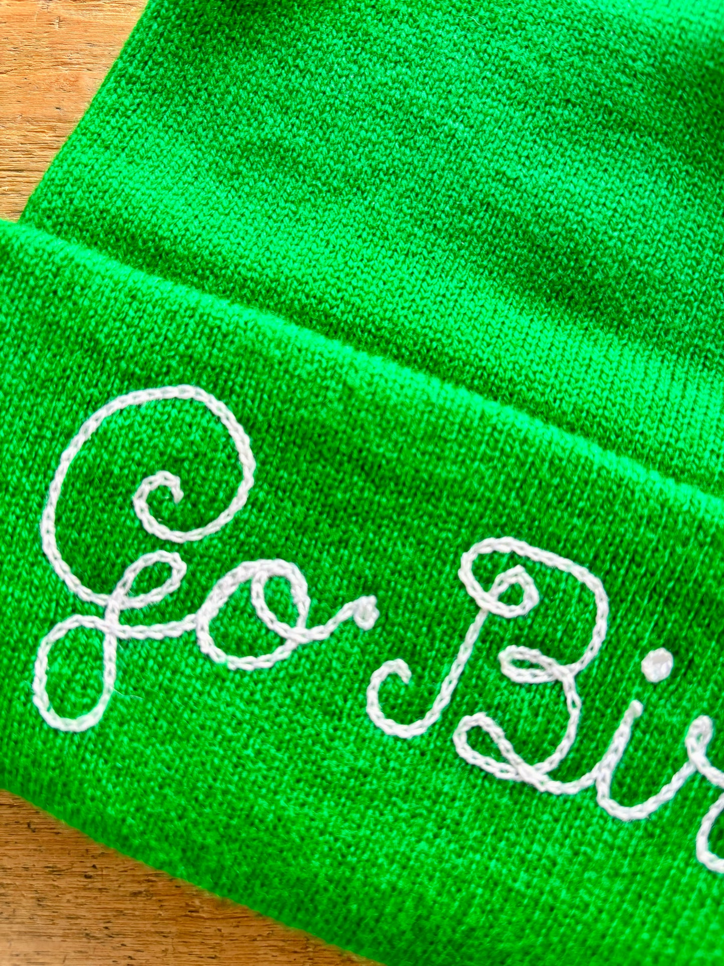 Go Birds kelly green chainstitched beanie representing the Philadelphia Eagles in loopy script embroidery