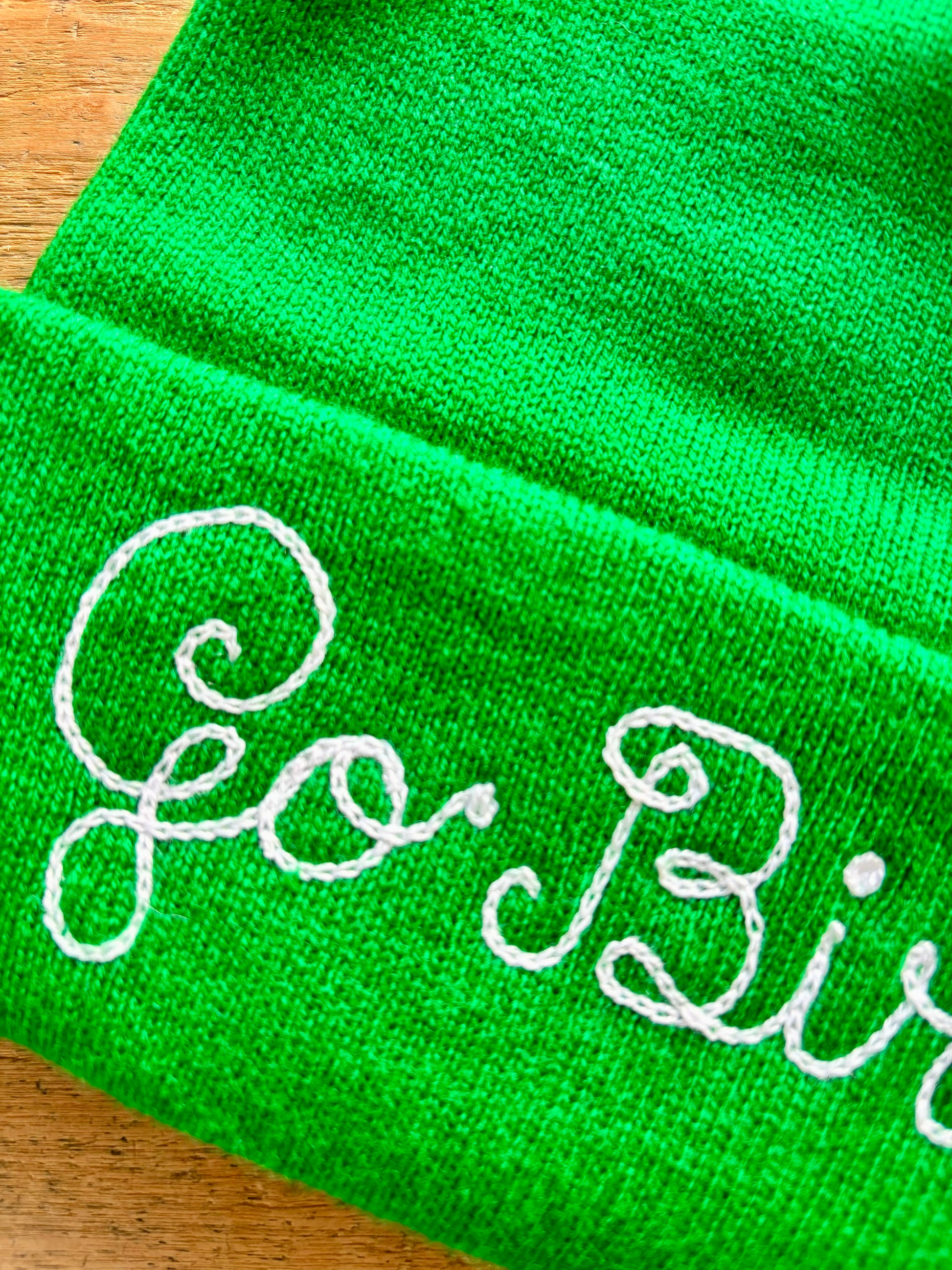 Go Birds kelly green chainstitched beanie representing the Philadelphia Eagles in loopy script embroidery