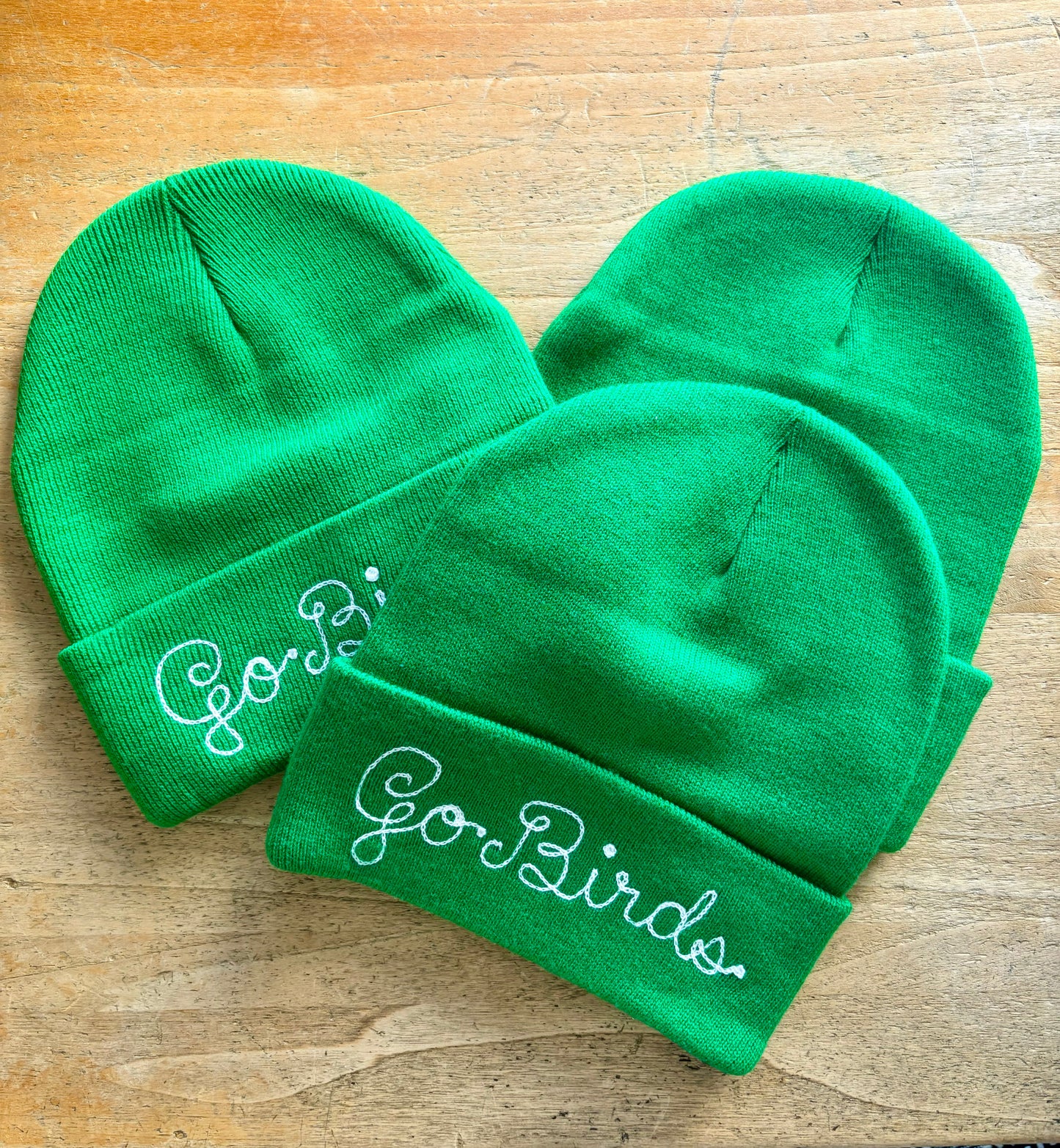 Kelly green go birds chainstitched beanie in loopy script embroidery