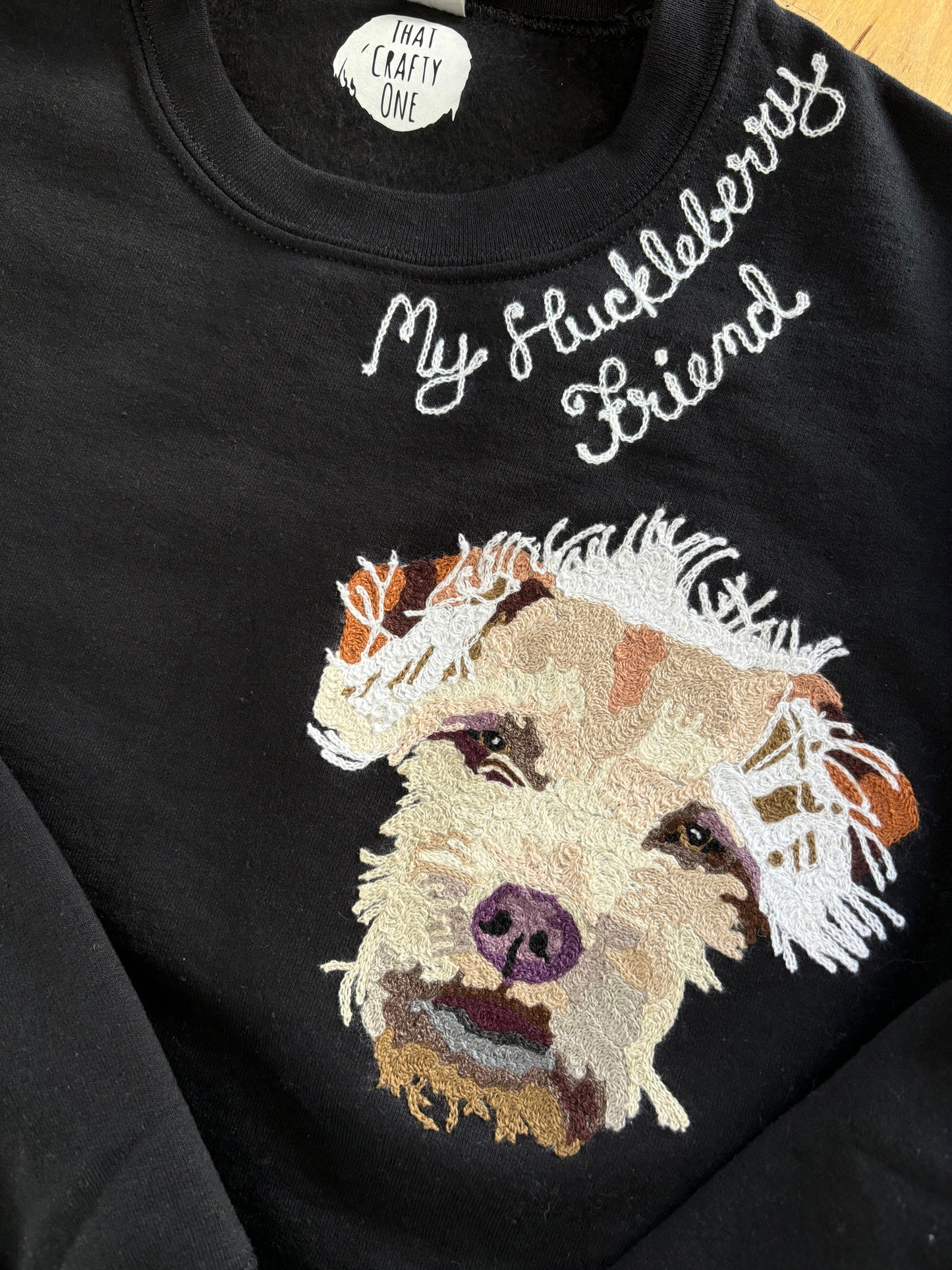 Chainstitch embroidery script and dog pet portrait on a cozy sweatshirt made right here in Philadelphia